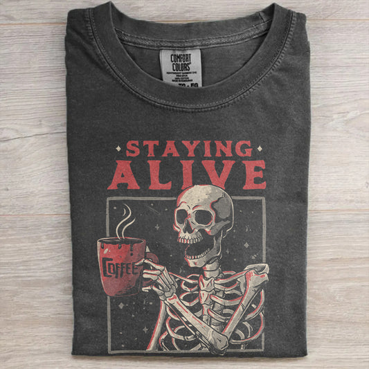 Staying Alive Coffee Tee – Funny Skeleton Halloween Comfort Colors Shirt