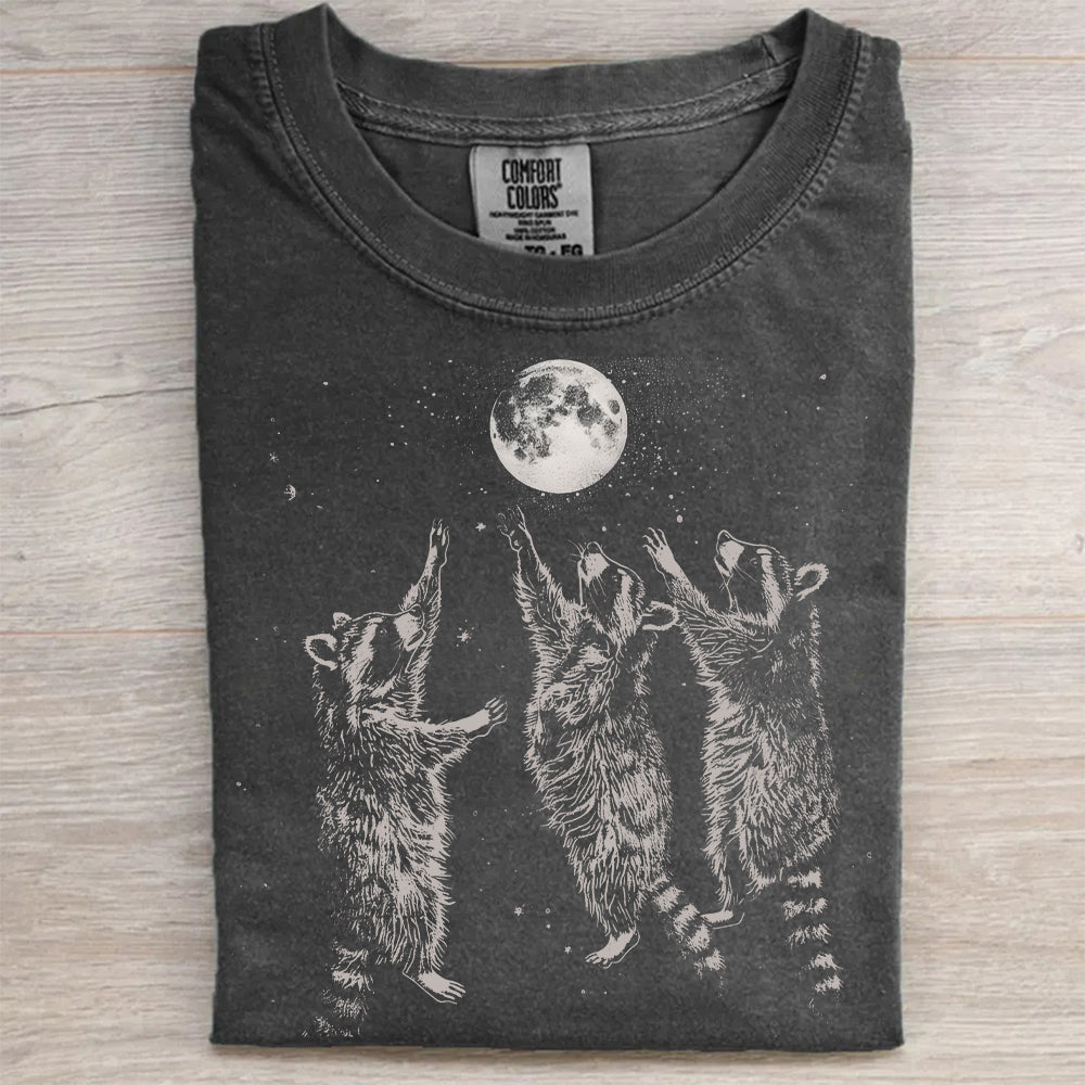 Three Raccoons Playing Under Moonlight T-Shirt
