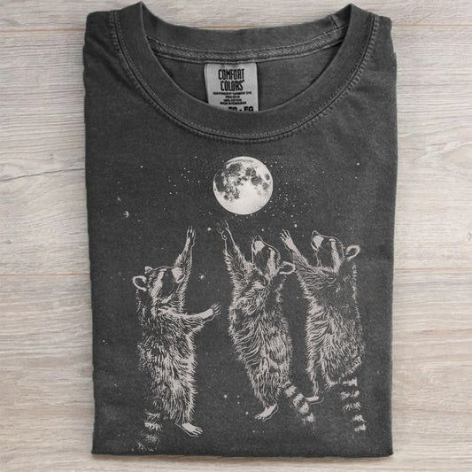 Three Raccoons Playing Under Moonlight T-Shirt