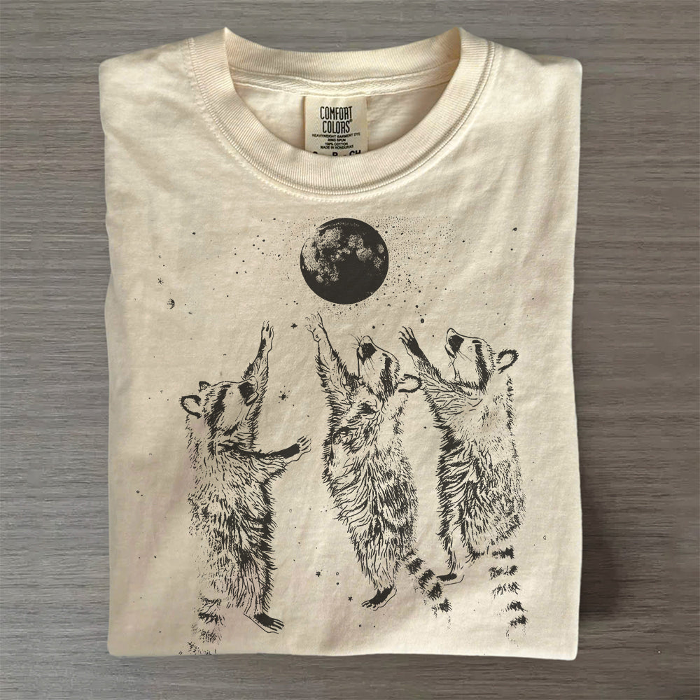 Three Raccoons Playing Under Moonlight T-Shirt