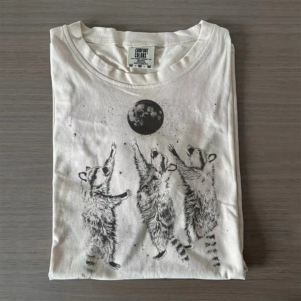 Three Raccoons Playing Under Moonlight T-Shirt