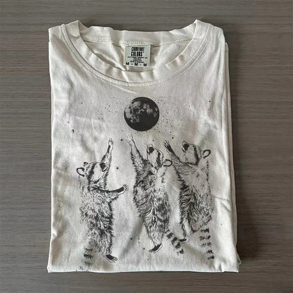 Three Raccoons Playing Under Moonlight T-Shirt